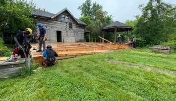 GECDSB construction students get hands on experience while repairing a deck at the John Freeman Walls Historic Site, June 5, 2025. (Photo by Maureen Revait) 