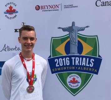 Lee Kucera with his silver medal at the Canadian Jr. National Track & Field Championships. (Photo courtesy of Courtney Bovin)
