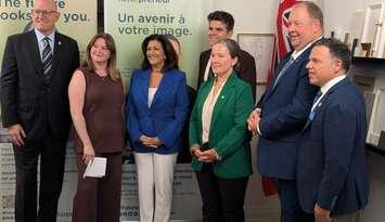 From left, Windsor Mayor Drew Dilkens, business owner Markie Tuckett, Ontario Associate Minister of Small Business Nina Tangri, Windsor-Tecumseh MPP Andrew Dowie, Futurpreneur CEO Karen Greve Young, Parliamentary Assistant MPP Stephane Sarrazin, and Essex MPP Anthony Leardi at Timber + Plumb in Windsor, August 26, 2025. Photo by Mark Brown/WindsorNewsToday.ca. 