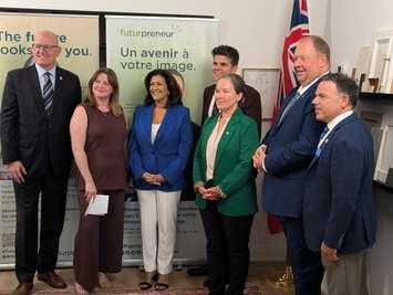 From left, Windsor Mayor Drew Dilkens, business owner Markie Tuckett, Ontario Associate Minister of Small Business Nina Tangri, Windsor-Tecumseh MPP Andrew Dowie, Futurpreneur CEO Karen Greve Young, Parliamentary Assistant MPP Stephane Sarrazin, and Essex MPP Anthony Leardi at Timber + Plumb in Windsor, August 26, 2025. Photo by Mark Brown/WindsorNewsToday.ca. 