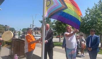 The 2SLGBTQIA+ flag raised at Windsor City Hall to mark the beginning of Windsor Essex Pride Fest, August 1, 2025. (Photo by Maureen Revait)