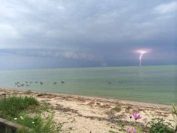 A lightning strike is seen in this photo taken in Belle River on Lake St. Clair on August 26, 2014. (Photo courtesy Adam Hooper)