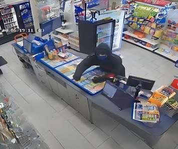 A person is shown on surveillance camera robbing a business in Windsor, May 15, 2024. Image provided by Windsor police.