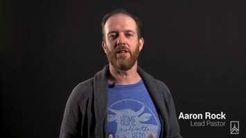 Harvest Bible Church Lead Pastor Reverand Dr. Aaron Rock seen in a YouTube video posted on the church website. 