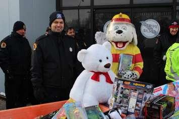 Windsor firefighters collect toys from Chrysler, being donated to Sparky's Toy Drive, November 20, 2014. (photo by Mike Vlasveld)