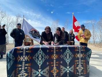 Caldwell First Nation Chief Mary Duckworth and Parks Canada Project Manager Maria Papoulias sign MOU for Ojibway National Urban Park at Point Pelee National Park, March 25, 2024. (Photo by Maureen Revait)