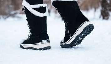 File photo of person walking in the snow courtesy of © Can Stock Photo / AMBERLIGHTPHOTO