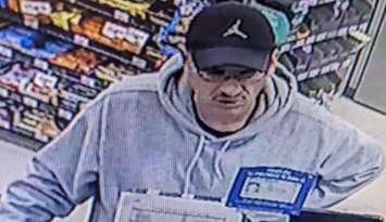 A security camera image of a man suspected in a break-and-enter and fraud case is seen in Windsor on November 4, 2024. Image provided by Windsor police.