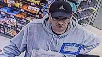 A security camera image of a man suspected in a break-and-enter and fraud case is seen in Windsor on November 4, 2024. Image provided by Windsor police.