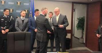 Windsor Police Constable David Drummond congratulated by Windsor Mayor Drew Dilkens, January 23, 2020. (Photo by Maureen Revait)