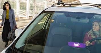A Lyft driver picking up a woman. File photo courtesy of www.lyft.com.