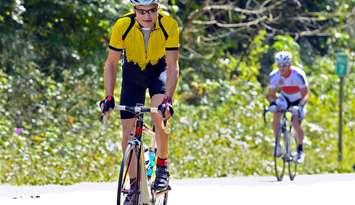 Man on a bicycle during a cycling event. Canstock photo.