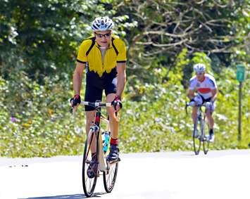 Man on a bicycle during a cycling event. Canstock photo.