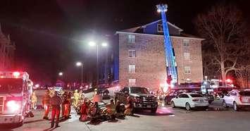 Firefighters use an aerial ladder to battle a fire at a 516 Albert Street in Strathroy, November 9, 2020. Photo courtesy of Strathroy-Caradoc Police. 