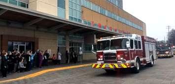 A Sarnia firetruck drives by Bluewater Health in a show of support for healthcare workers during the COVID-19 pandemic. 31 March 2020. (Screen-grab from a video by Sarnia Fire)