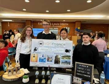 Maranatha Christian Academy students, from left, Alisa Preston, Owen Turner, Bethany Liem, and David Moloce show off their display at the University of Windsor Odette School of Business. Photo courtesy Maranatha Christian Academy/Instagram.