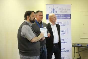 Graduate of Mission Enterprise program receives certificate, February 20, 2020. (Photo by Maureen Revait)