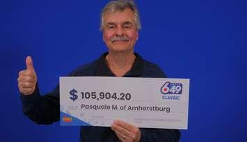 Pasquale Mazzei of Amherstburg displays his prize cheque at the OLG Prize Centre in Toronto. Photo courtesy Ontario Lottery and Gaming.