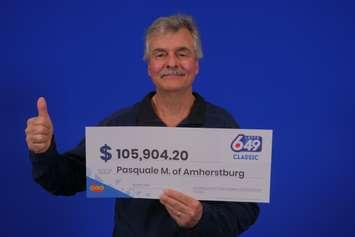 Pasquale Mazzei of Amherstburg displays his prize cheque at the OLG Prize Centre in Toronto. Photo courtesy Ontario Lottery and Gaming.