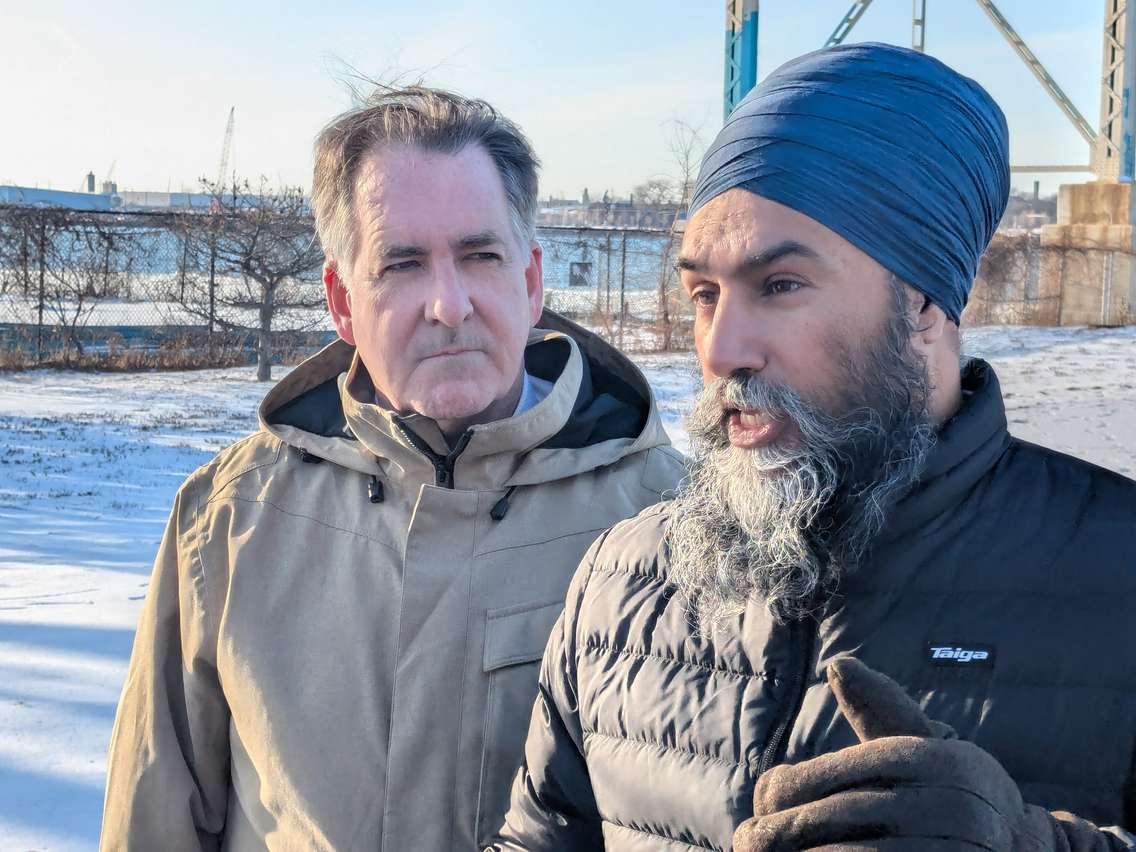 Federal NDP Leader Jagmeet Singh speaks to reporters as Windsor West MP Brian Masse listens at the Ambassador Bridge in Windsor, February 10, 2025. Photo by Mark Brown/WindsorNewsToday.ca.