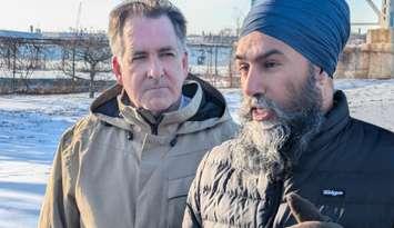 Federal NDP Leader Jagmeet Singh speaks to reporters as Windsor West MP Brian Masse listens at the Ambassador Bridge in Windsor, February 10, 2025. Photo by Mark Brown/WindsorNewsToday.ca.