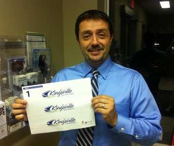 Kingsville Mayor Nelson Santos shows off the town's new logo.
