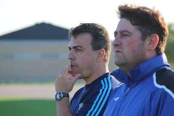 Former Windsor Stars Head Coach Steve Vagnini (furthest) and Goalie Coach Eddie Krusarovski watch on at a team practice on June 3, 2014. (Photo by Ricardo Veneza)