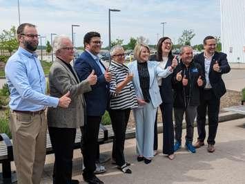 From left, Lakeshore Councillor Ryan McNamara, Deputy Mayor Kirk Walstedt, Kingsville Mayor Dennis Rogers, Essex County Warden and Leamington Mayor Hilda MacDonald, Lakeshore Mayor Tracey Bailey, Connect Windsor-Essex CEO Joanne Soave, Lakeshore Councillor Paddy Byrne, and Windsor-Tecumseh MP Irek Kusmierczyk, at Atlas Tube Recreation Centre in Lakeshore, May 14, 2024. Photo by Mark Brown/WindsorNewsToday.ca.