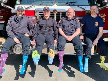 Sarnia firefighters show their colourful socks for World Down Syndrome Day. File photo courtesy of the Sarnia Fire Rescue Service.