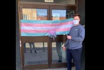 Trans Wellness Ontario Executive Director Alexander Reid celebrates the branding of the organization, March 31, 2021. (via Facebook) 