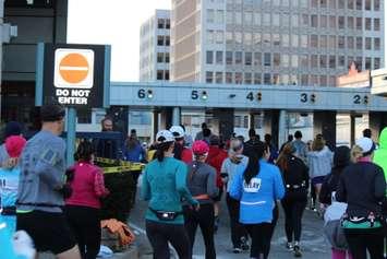 Runners enter the Windsor-Detroit Tunnel Plaza during the Detroit Free Press Marathon, 2014.  (Photo by Adelle Loiselle.)