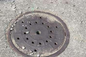 A manhole cover.  (Photo by Adelle Loiselle.)