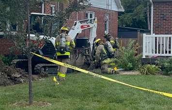 Firefighters attend the scene at 67 Queen Street South in Tilbury after an oily substance was found during some digging. (Photo courtesy of Chatham-Kent Fire and Emergency Services)