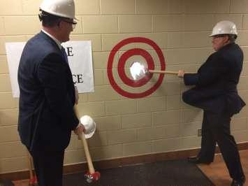 Windsor Mayor Drew Dilkens (left) and Windsor Public Library Board Chair Peter Frise (right) take turns breaking a wall which will eventually become the entrance to the Optimist Public Library from the Optimist Community Centre, March 8, 2017. (Photo by Mike Vlasveld)