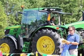 Volunteers demonstrate tractor safety at the Chatham-Kent Children's Safety Village, August 24, 2016 (Photo by Jake Kislinsky)