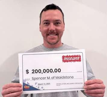 Spencer Mickle displays his $200,000 prize cheque at the OLG Prize Centre in Toronto, March 13, 2025. Photo courtesy Ontario Lottery and Gaming.