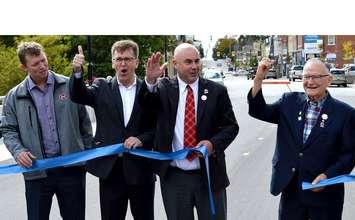 Former Arran-Elderslie Mayor Ron Oswald [right] cuts the ribbon to officially open the Oswald Bridge in Chesley, joined by current Mayor Steve Hammell, Bruce-Grey-Owen Sound MPP Bill Walker and Bruce County Warden Mitch Twolan.(photo by Jordan MacKinnon)