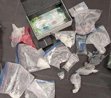 An assortment of suspected illicit drugs, cash, and other items are displayed on October 7, 2024. Photo courtesy LaSalle police.