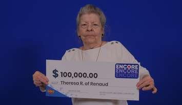 Theresa Renaud of Essex shows off her $100,000 cheque at the OLG Prize Centre in Toronto, January 24, 2025. Photo courtesy Ontario Lottery and Gaming.