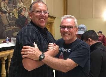 Unifor Local 444 President Dave Cassidy shakes hands with a union member Monday June 4, 2018. (Photo by Paul Pedro)