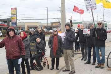 Protestors on Tecumseh Road East and Walker Road, Windsor, December 12, 2022. Photo by Mark Brown/WindsorNewsToday.ca.