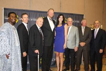 The 2015 inductees into the Windsor-Essex County Sports Hall of Fame. From left to right: Oshiomogho Atogwe, Dan Murray, Paul "Doc" Thomas, Scott Russel, Maria Carlini, Jack Costello, David Cooper, Mark Pare. (Photo by Ricardo Veneza)