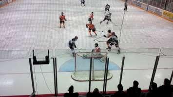 Essex 73's netminder Jacob Kment makes a save against a Dresden Junior Kings player. Photo taken February 4, 2014. (Ricardo Veneza)