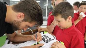 NHL defenceman Aaron Ekblad signs a jersey for a student at F.J. Brennan Sports Academy, Friday May 27, 2016. (Photo by Maureen Revait) 