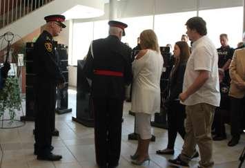 Windsor police and the family of Constable John Atkinson place a wreath at the 10 year anniversary memorial service, May 5, 2016. (Photo by Maureen Revait) 
