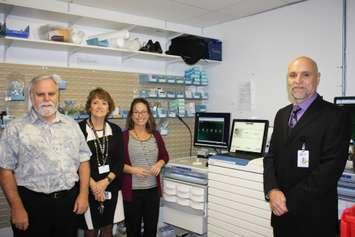 Photo (L-R): Stephen Townsend, Durham and Community Health Care Foundation Board of Directors, Anne Marie Watson, Durham and Community Health Care Foundation Coordinator, Lynn Bos, SBGHC Clinical Education Coordinator, Paul Rosebush, SBGHC President and CEO, with medication cart and cabinet. (Submitted photo)