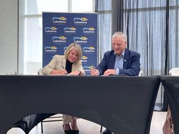 Municipality of Lakeshore Mayor Tracey Bailey and University of Windsor President Robert Gordon sign MOU, May 20, 2025. (Photo by Maureen Revait) 