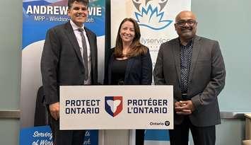 Windsor-Tecumseh MPP Andrew Dowie (left), announces an Ontario Trillium grant for Family Services Windsor-Essex (FSWE), with Acting Executive Director Ciara Holmes, and Ontario Trillium Foundation volunteer Shaun Dass, July 31, 2025. Photo courtesy Family Services Windsor Essex