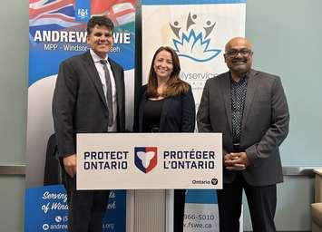 Windsor-Tecumseh MPP Andrew Dowie (left), announces an Ontario Trillium grant for Family Services Windsor-Essex (FSWE), with Acting Executive Director Ciara Holmes, and Ontario Trillium Foundation volunteer Shaun Dass, July 31, 2025. Photo courtesy Family Services Windsor Essex