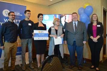 Justin Lafontaine of the Ontario Tourism Innovation Lab, far left, winner Amy Saba, third left, and Gordon Orr of TWEPI, second right, pose at the Spark Program award presentation at Caesars Windsor, October 25, 2018. Photo by Mark Brown/Blackburn News.